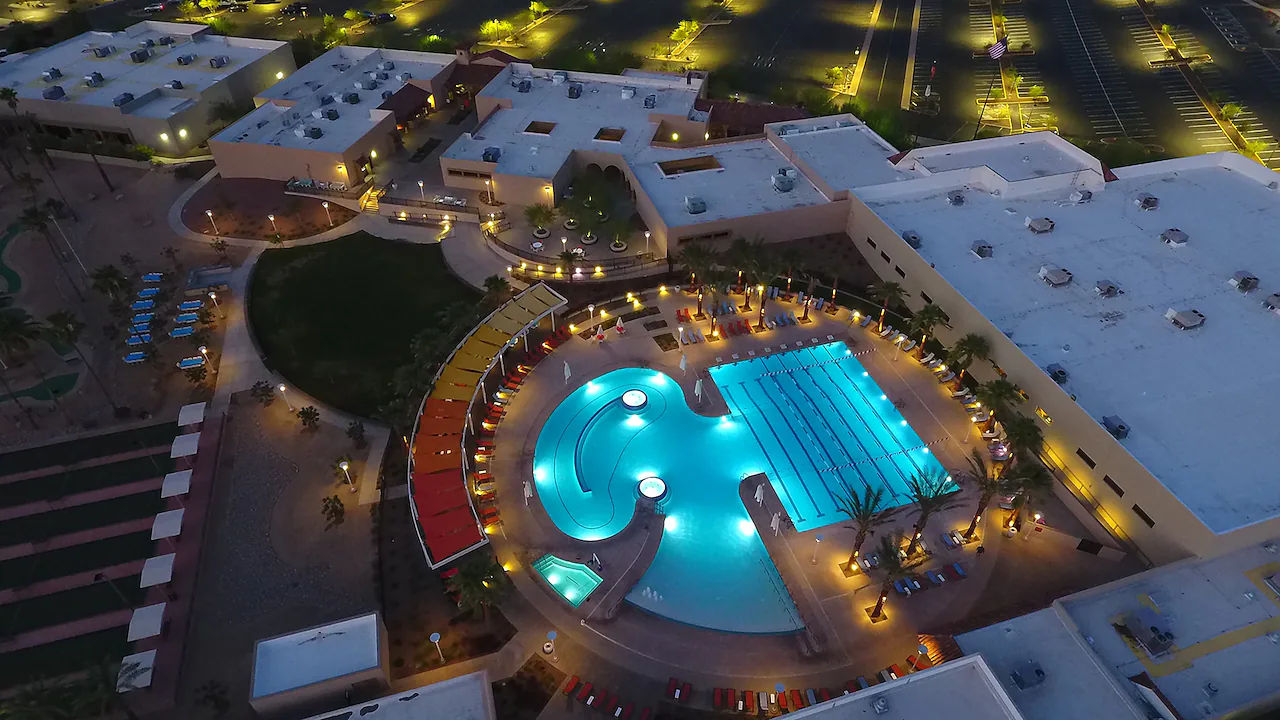 Aerial photo at dusk of the recreation center pool and community complex in Sun City West, Arizona